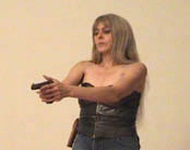 BDSM CLIP - Screenshot aus Lady Hermina - Domina mit Pistole